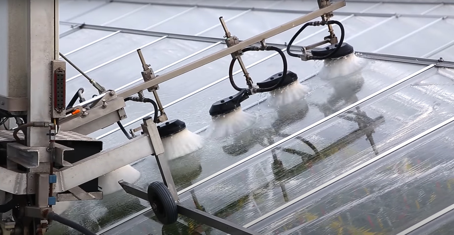 Cox V-PowerWasher greenhouse roof washing machine with aerial platform