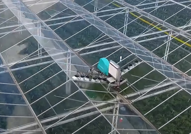 Cox V-PowerWasher greenhouse roof washing machine with aerial platform